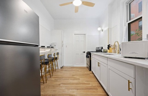 Upper Manhattan Apartment | 1 Min to Subway: King Bed, Luxe Airy Space + Patio