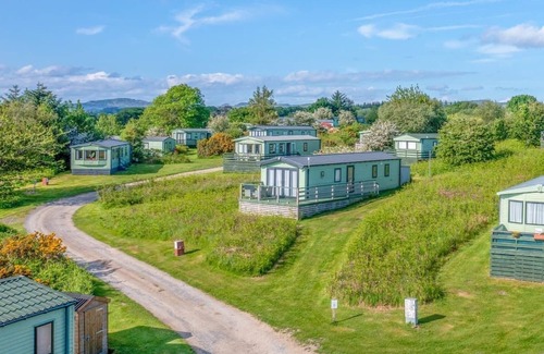 Castle Douglas House | 12ft-wide caravan situated in a coastal position.
