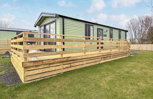 Castle Douglas House | 12ft-wide caravan situated in a coastal position.