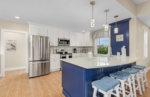 Mid Island House | 167 Mandalay Oasis: 3BR, Screened Patio & Beach Access