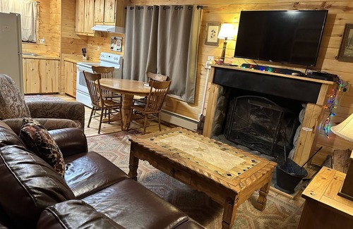 Greer Cabin | 2 BR-1BA Log Cabin on Main Street. Stocked trout pond, porch, dogs ok.