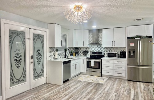 Clearwater House | 2 homes next to each other.Heated Pool, Spa & Backyard Games!