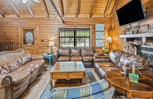 Rockport Cabin | 2-story cabin with an enclosed yard, patio, and large shade trees