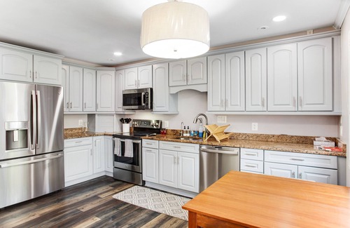 Edgewater House | 2-story, riverfront home with private dock, inviting deck & dog-friendly yard