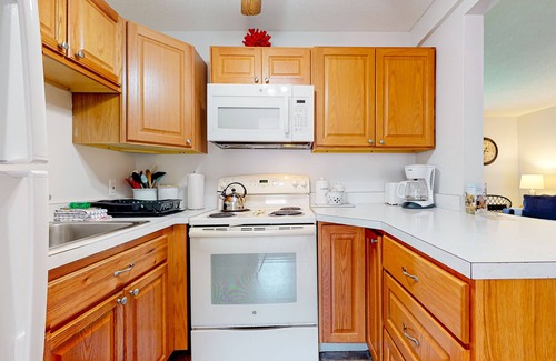 Weirs Beach Condo | 2nd-Floor condo with a private balcony, on-site beach, outdoor pool, laundry