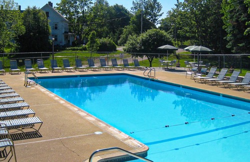 Weirs Beach Condo | 2nd-Floor condo with a private balcony, on-site beach, outdoor pool, laundry
