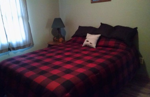 Grayling House | 3 BD, 2 BA Cabin on Big Creek in Lovells, MI