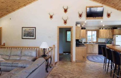 Harrison Cabin | 3-Bedroom Cabin Nestled in the Woods on a Pond! Sleeps 16-20 - ORV Trail access.