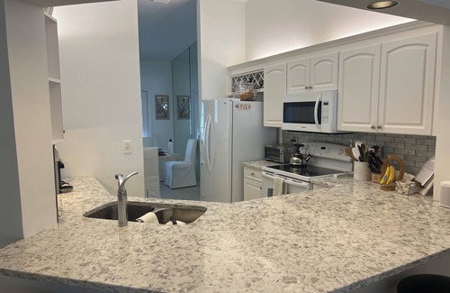 Pelican Bay Condo | 3 BR coach house at The Barrington Club in Pelican Bay. Private beach access.