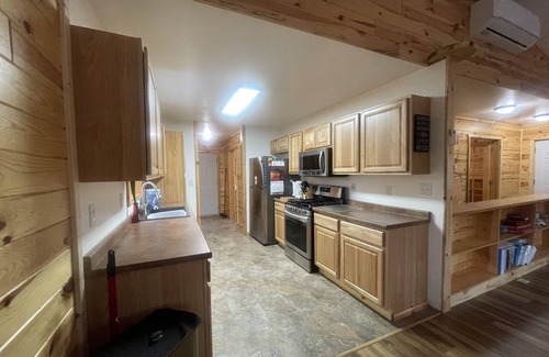 Newaygo House | 3 minutes from the Muskegon River! Quiet and spacious home with a large deck.