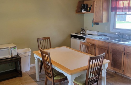 Oscoda Resort | #3 Thomas' Parkside Cottages, 2BR suite, private patio w/Lake Huron views.