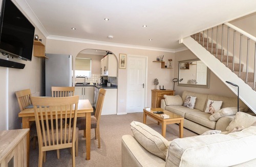 Corton House | 30 THE WATERSIDE HOLIDAY PARK, pet friendly, with a garden in Corton