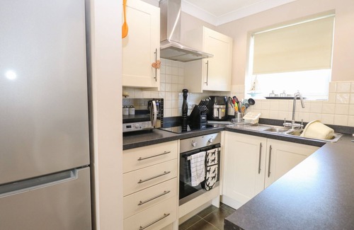 Corton House | 30 THE WATERSIDE HOLIDAY PARK, pet friendly, with a garden in Corton
