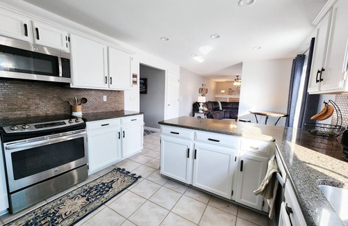Aurora House | 4 Bedroom Home with 2 living rooms, patio, & backyard.