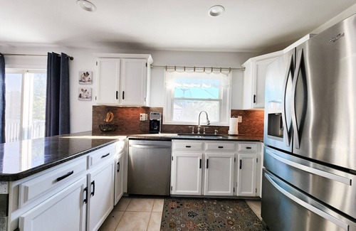 Aurora House | 4 Bedroom Home with 2 living rooms, patio, & backyard.
