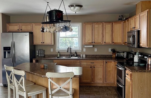 Winthrop House | 4-bedroom Waterfront LAKEHOUSE in Maine. Hot tub, firepit, deck & private dock.