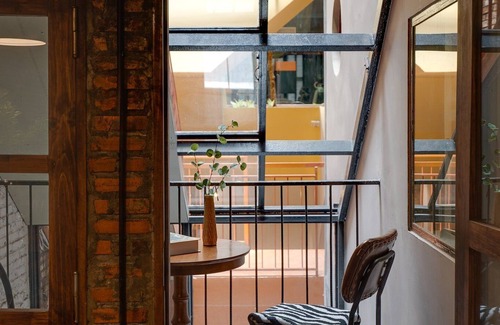 Downtown Ho Chi Minh City House | 4BR Industrial Gem with Rooftop Garden by Bến Thành