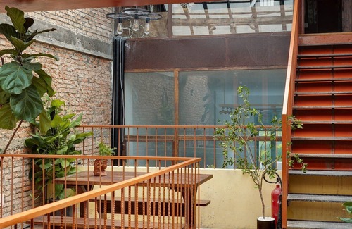 Downtown Ho Chi Minh City House | 4BR Industrial Gem with Rooftop Garden by Bến Thành