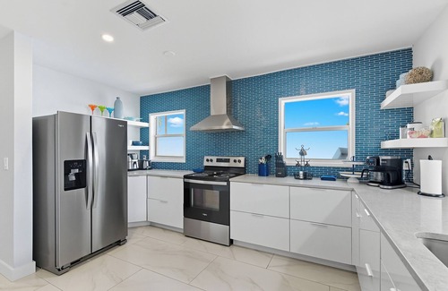 Indian Rocks Beach House | 5 Bed WTFT heated pool dock 6 seat golf cart