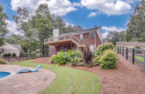Flowery Branch House | 6-bedroom pool house near lake in Flowery Branch with fitness & game room