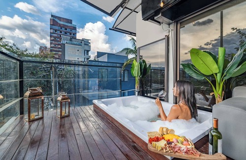 Zona Rosa House | 9BR Indoor Heated Pool & Jacuzzi | In Lleras Park