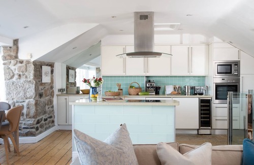 Mousehole Cottage | A beautifully refurbished stone cottage that sits right on Mousehole Harbour's waters edge.