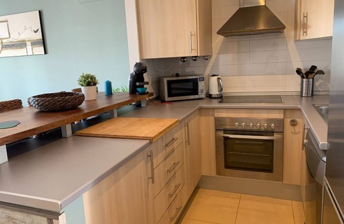 Alhama de Murcia Apartment | A fresh modern apartment on a lovely garden with a shared pool