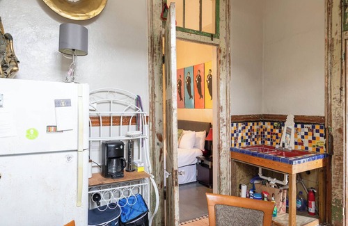 Treme Apartment | A funky-chic one-bedroom apartment with a private entrance and a full kitchen.