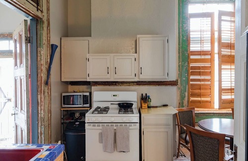 Treme Apartment | A funky-chic one-bedroom apartment with a private entrance and a full kitchen.