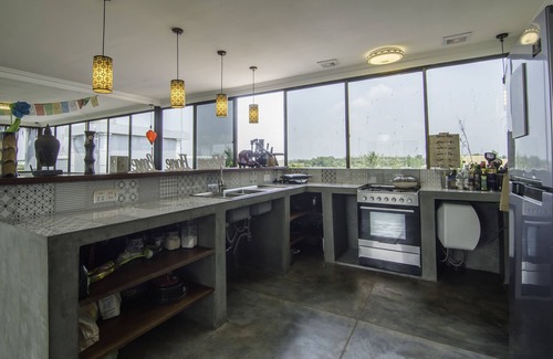 Siem Reap House | A home away from home! Coliving building with private rooms and shared areas.