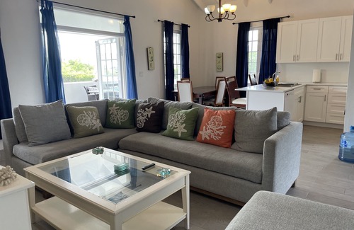Long Bay Hills Cottage | A Kiteboarders Dream complete with a Pickle Ball Court and a Pool!