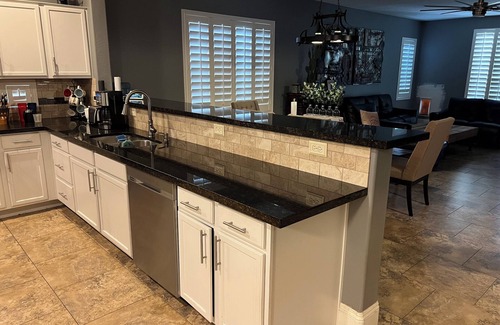Buckeye House | A pet-friendly cozy 4 bedroom home with a resort style pool in the backyard.