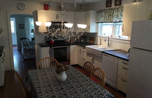 Lakeside Cottage | A picture perfect restored original cottage located inside the gates of Lakeside