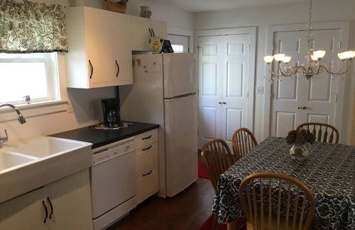 Lakeside Cottage | A picture perfect restored original cottage located inside the gates of Lakeside