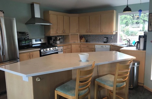 Northeast Tacoma House | A Sound view with hot tub.