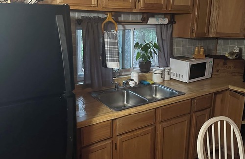 Mio Cabin | A Stream runs through it. Comfy little cabin with a stream by your bedroom.