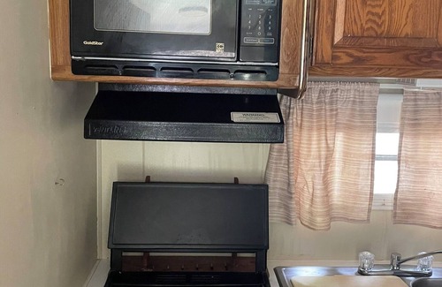 Grayling House | A well-maintained, vintage camper in a secluded location near state land