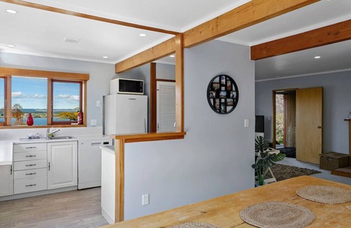Acacia Bay House | Acacia Bay Retreat | Stylish Family Getaway with Fireplace & Lake Views