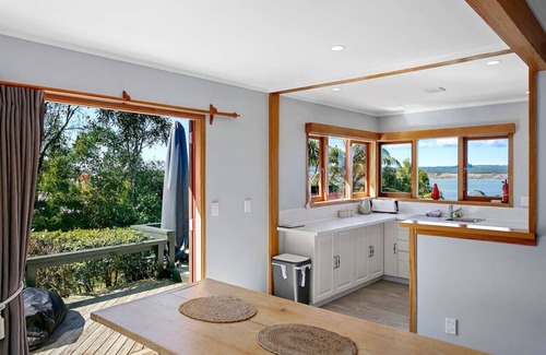 Acacia Bay House | Acacia Bay Retreat | Stylish Family Getaway with Fireplace & Lake Views