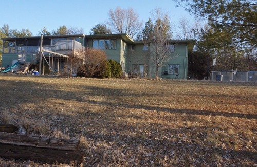 Urbandale House | Acreage InTown 4 BR, 2 Bath 3,300 sq ft half house option with gymnasium.
