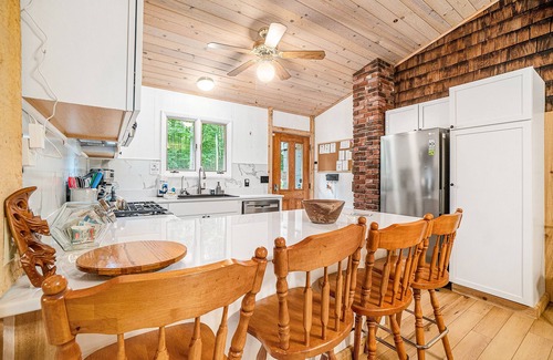 Lake Township House | Amazing riverfront retreat with firepit, patio, W/D, & great views