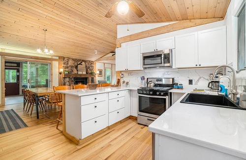 Lake Township House | Amazing riverfront retreat with firepit, patio, W/D, & great views