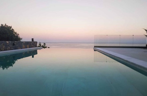 Pefki Villa | An exquisite and luminous seaside villa. The epitome of coastal serenity.