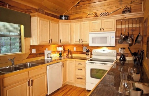Tellico Plains Cabin | Angler cabin. This modern private studio Cabin with HOT TUB is tucked away in a wooded cove.