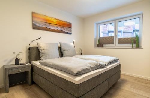 Dorumer Neufeld Apartment | Ankerpunkt Südost - Ferienwohnung mit Garten und Sauna