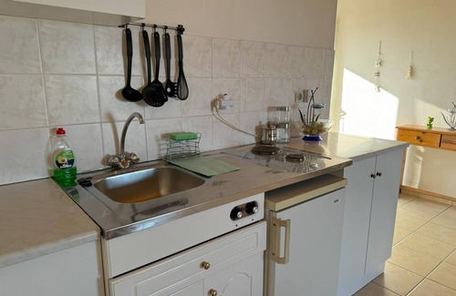 Kompi Apartment | Apartment above Peroulia beach near Koroni - taverna in front of the house