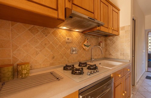 Li Cuncheddi Apartment | Apartment 'Casa Vacanze Ciliegio' with Sea View, Shared Pool and Air Conditioning