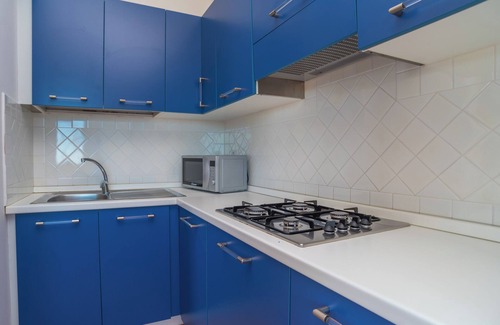 Porto Ottiolu Apartment | Apartment Close to the Beach with Balcony, Sea View & Air Conditioning