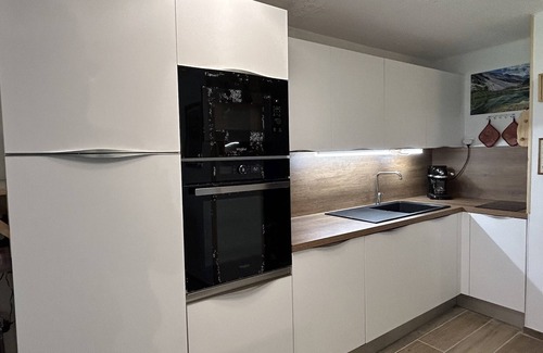 Meribel-Mottaret Apartment | Apartment in Méribel with balcony, direct slope access and equipped kitchen