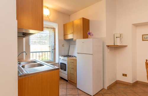 Rosignano Marittimo Apartment | Apartment 'Malva' with Shared Pool and Garden